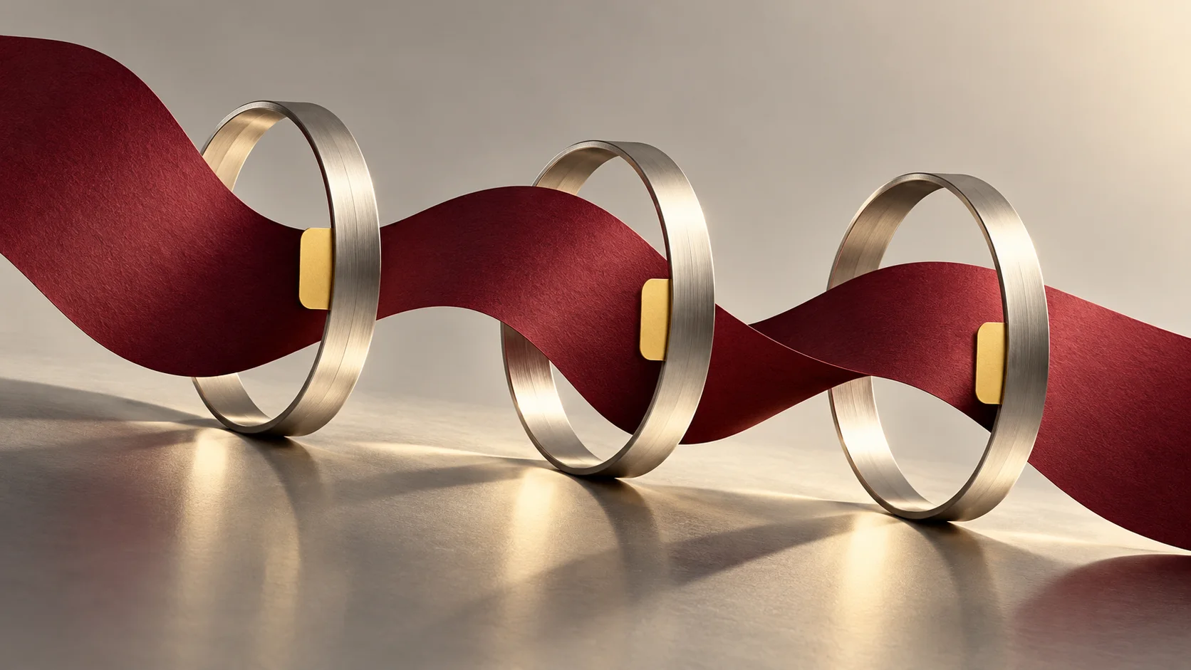 A burgundy ribbon passes through a sequence of silver rings with yellow review tabs